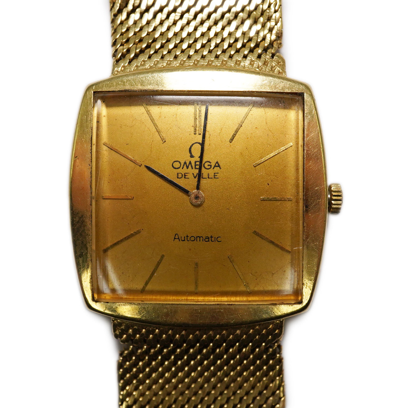 A gentleman's early 1960's 18ct gold Omega De Ville automatic dress wrist watch, on integral Omega 18ct gold mesh link bracelet